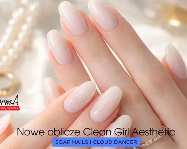 Delikatne, mleczne paznokcie w stylu clean girl, ozdobione subtelnym brokatem. Idealne dla każdej kobiety ceniącej elegancję.
